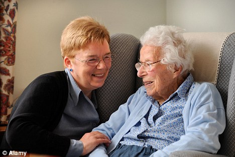 old woman talking to caregiver