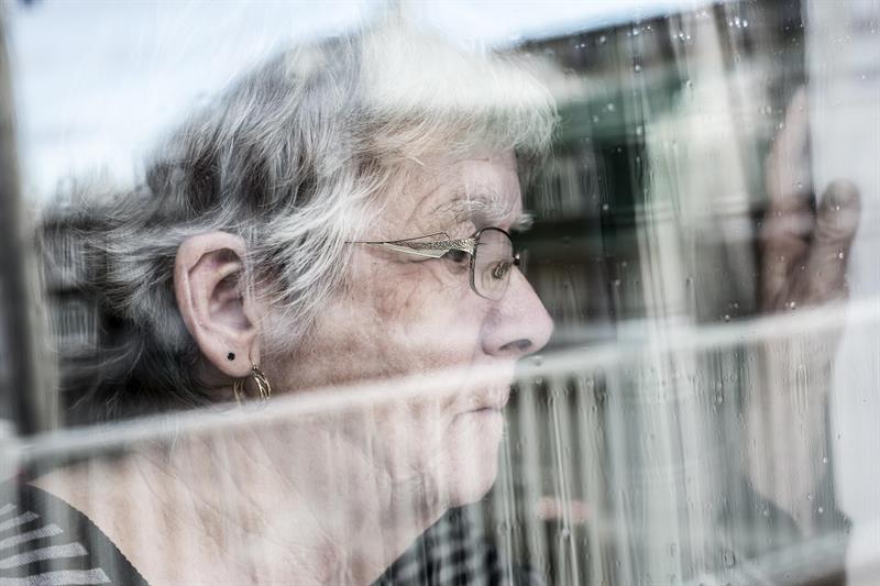 dementia patient looking through window