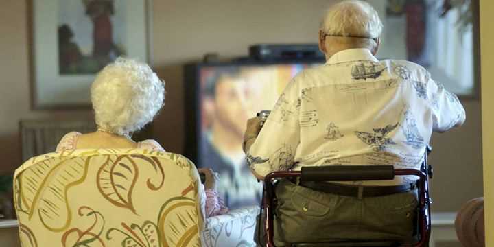 elderly people watching tv 