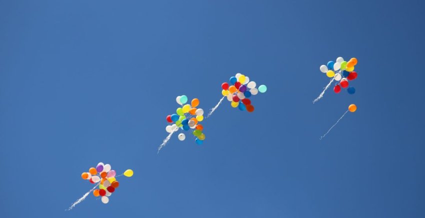 flying away balloons