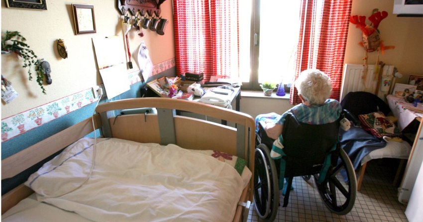 senior lady on wheelchair in care home