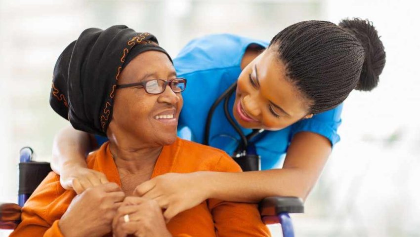 woman caregiver with older African American woman