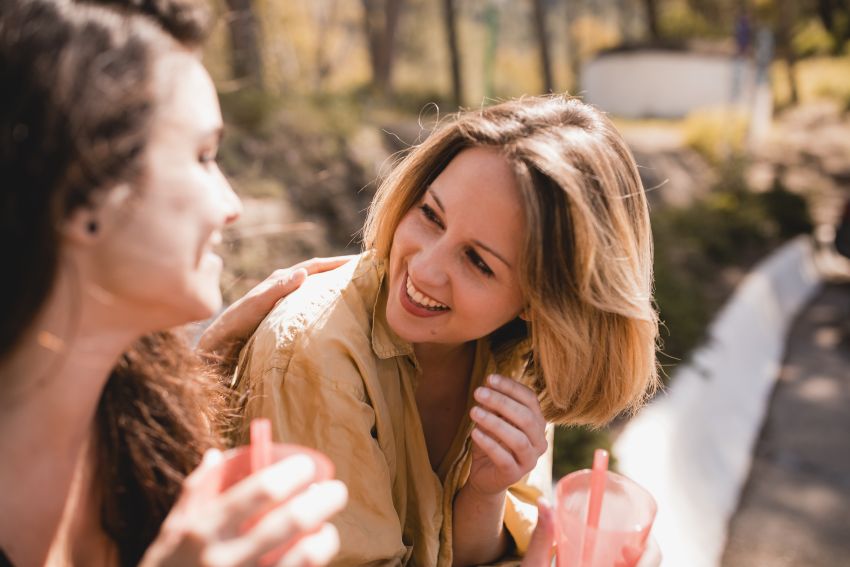 women smiling laughing chatting